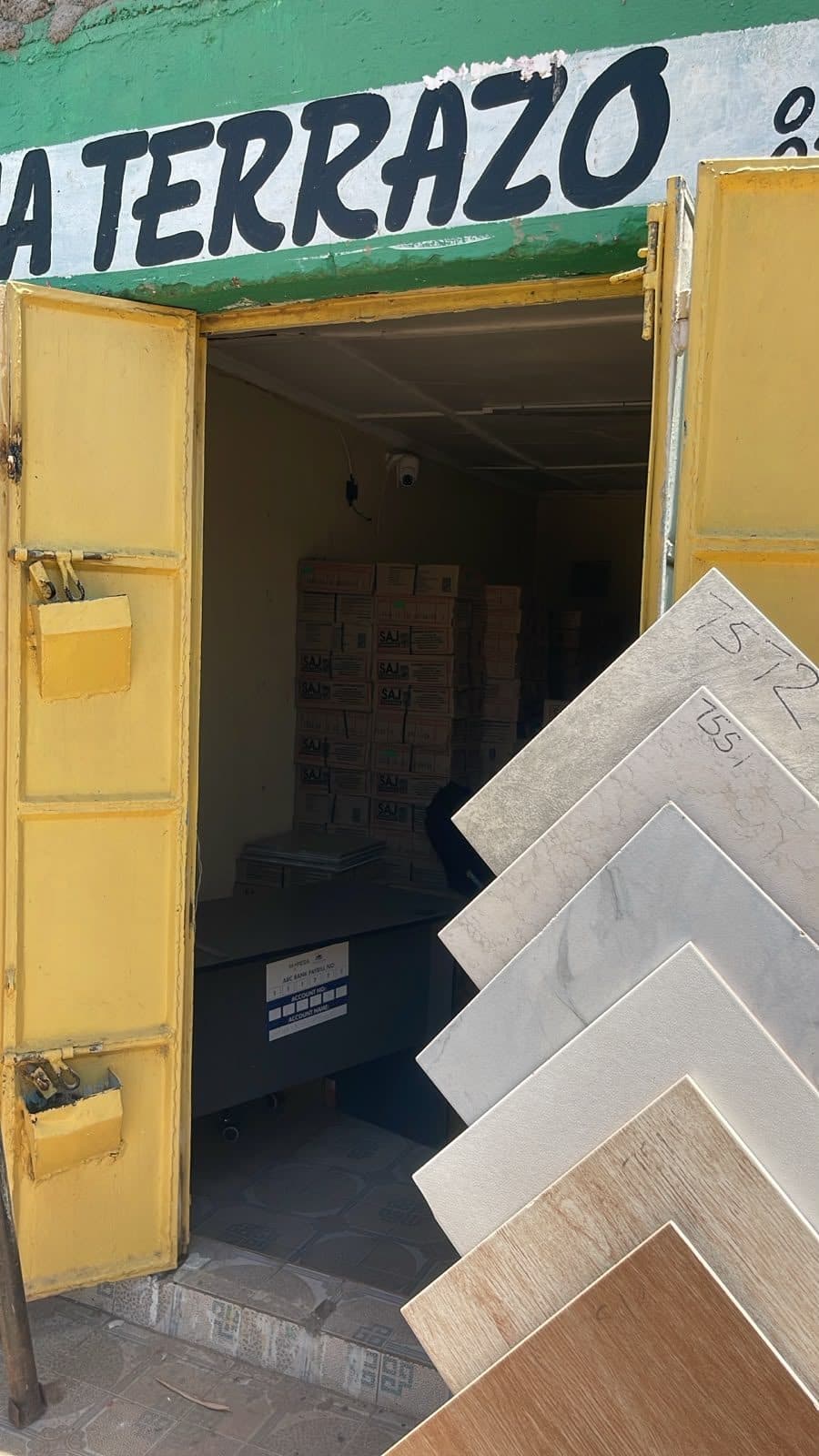 Shop entrance with tile samples displayed at the door
