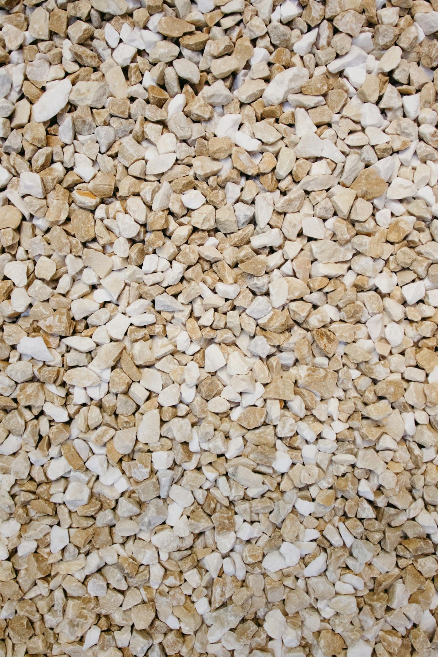 Illustrative photo: small crushed cream coloured stone chips
