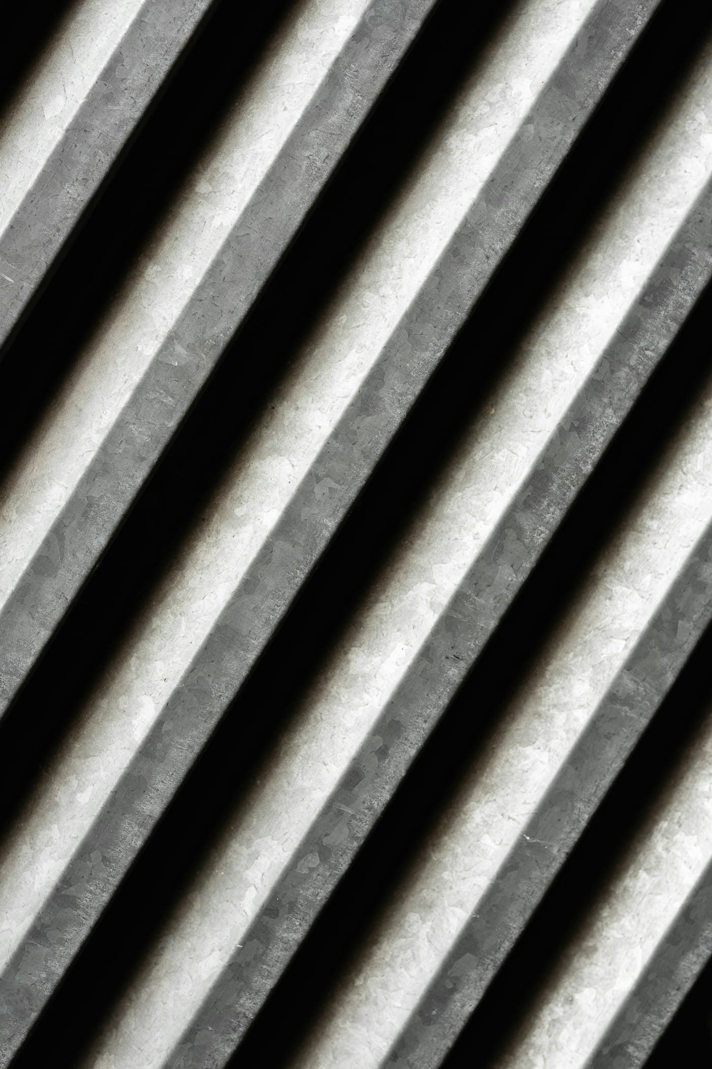Illustrative photo: parallel metal strips in black and white