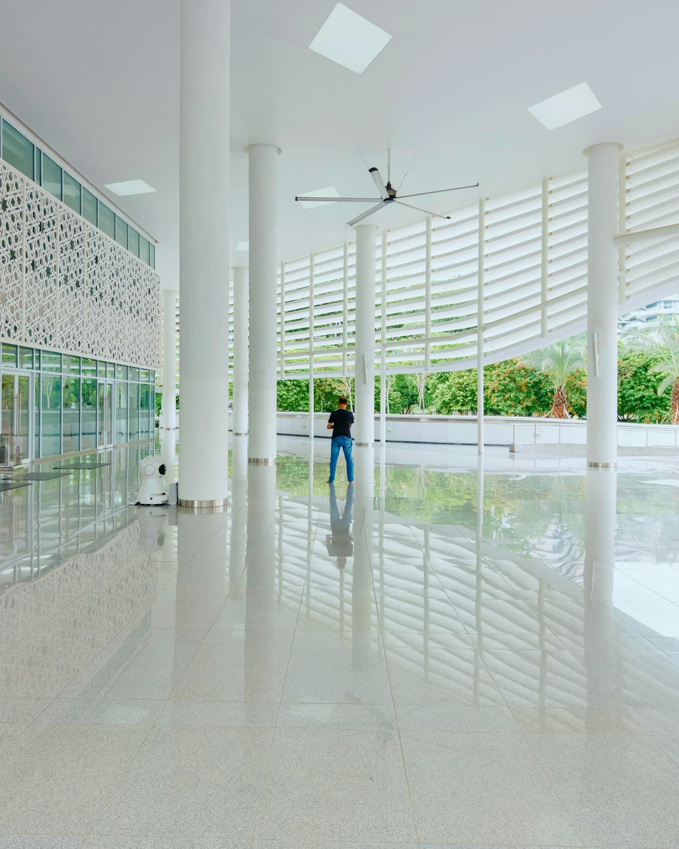 Illustrative photo: a glossy polished floor in a bright hall